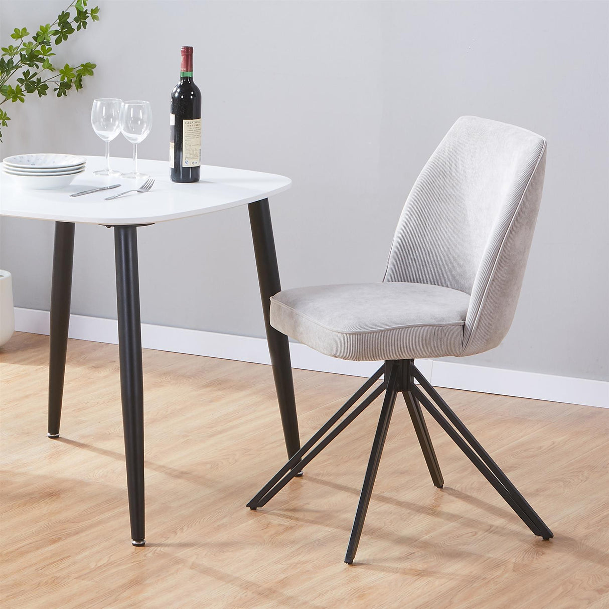 Aspen swivel dining chairs, light grey cord fabric with black metal legs (pair)
